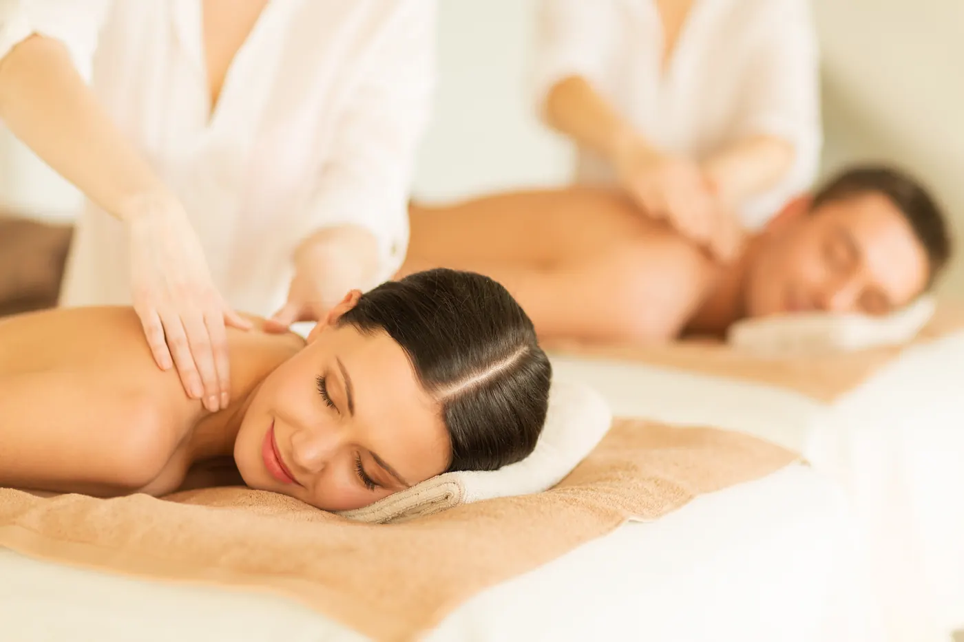 Couples massage on dual tables at Massage Time Spa